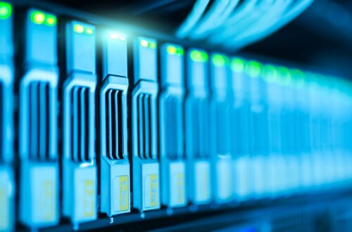 Detailed image of a server rack with glowing lights in a modern data center.