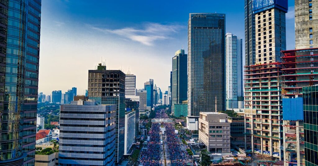 Stunning aerial view of Jakarta's modern skyline with bustling streets below.