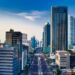 Stunning aerial view of Jakarta's modern skyline with bustling streets below.