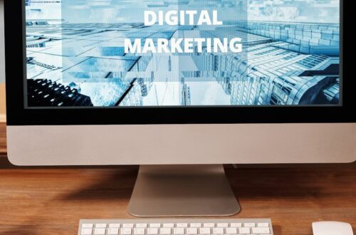 Contemporary office setup featuring digital marketing strategy on a computer screen, ideal for business technology themes.